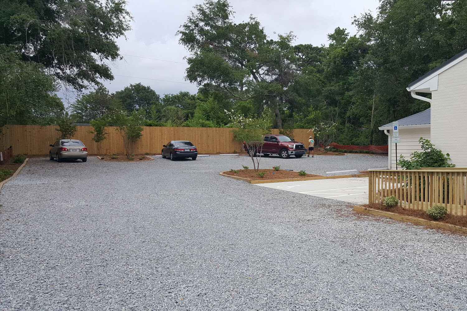Finished gravel driveway with parking spots.